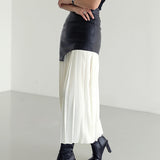 Orla | Asymmetrical pleated maxi skirt with coated finish