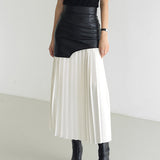 Orla | Asymmetrical pleated maxi skirt with coated finish