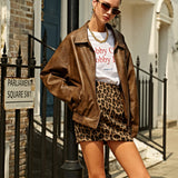 Nysera | Urban three-piece streetwear outfit with vintage leather jacket and leopard mini skirt