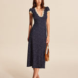 Noralisse | Polka Dot Midi Dress with Lace Details and Puff Sleeves