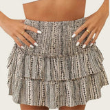 Ivy | High-waisted ruffle mini skirt with smocked waist