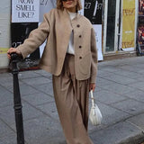 Sylvena | Oversized wool jacket with asymmetric button closure and generous pockets